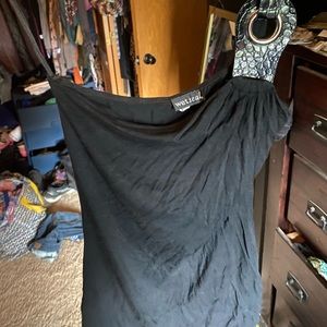 Black tank top, worn a few times, strap over one shoulder.